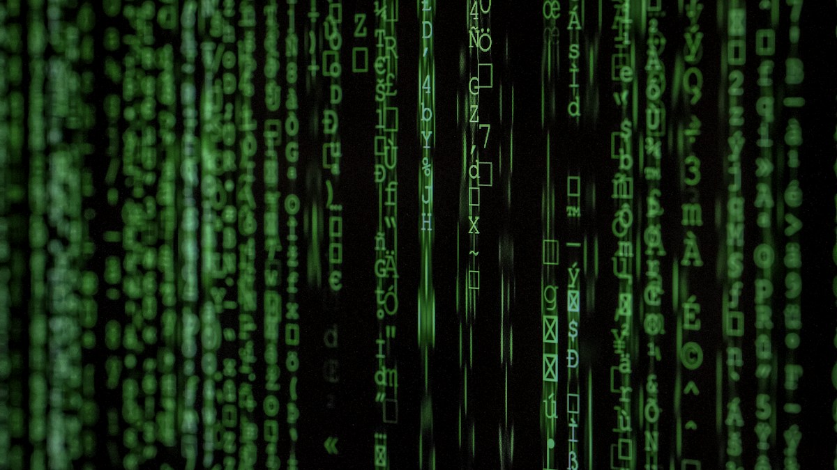 Cyber defense analysts monitoring global telemetry screens in security operations center
