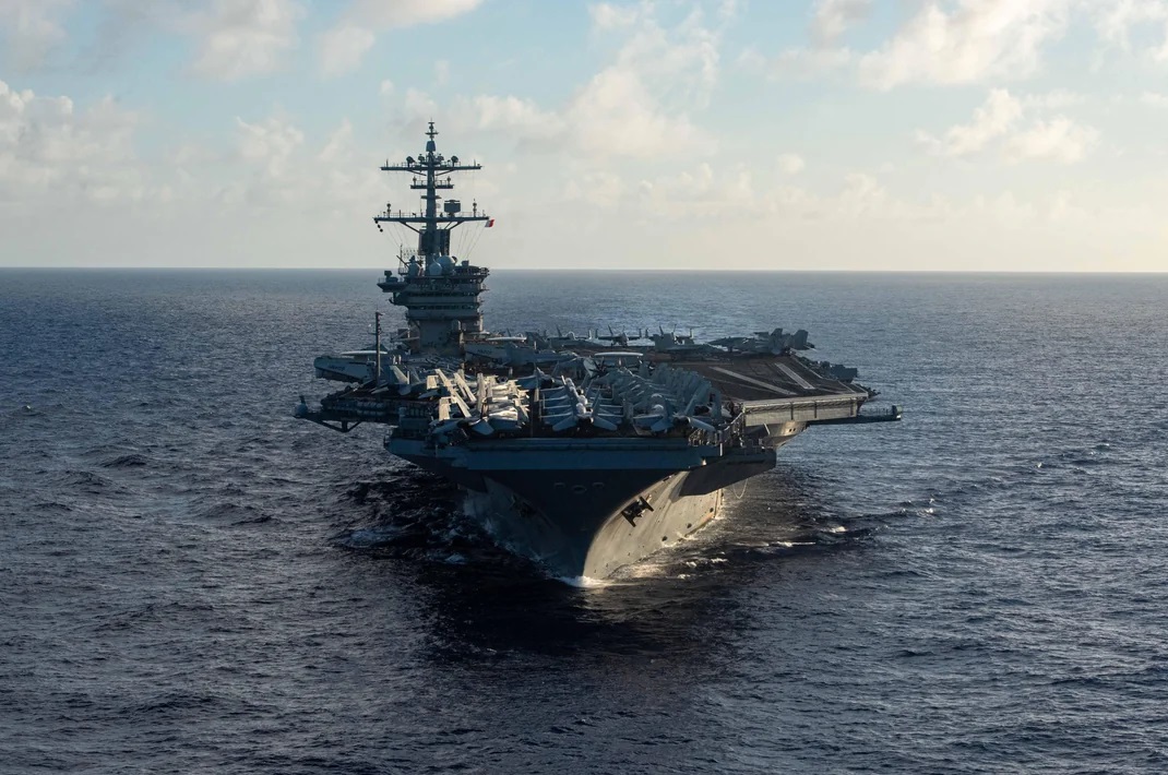 USS Theodore Roosevelt Carrier Strike Group underway with allied escorts